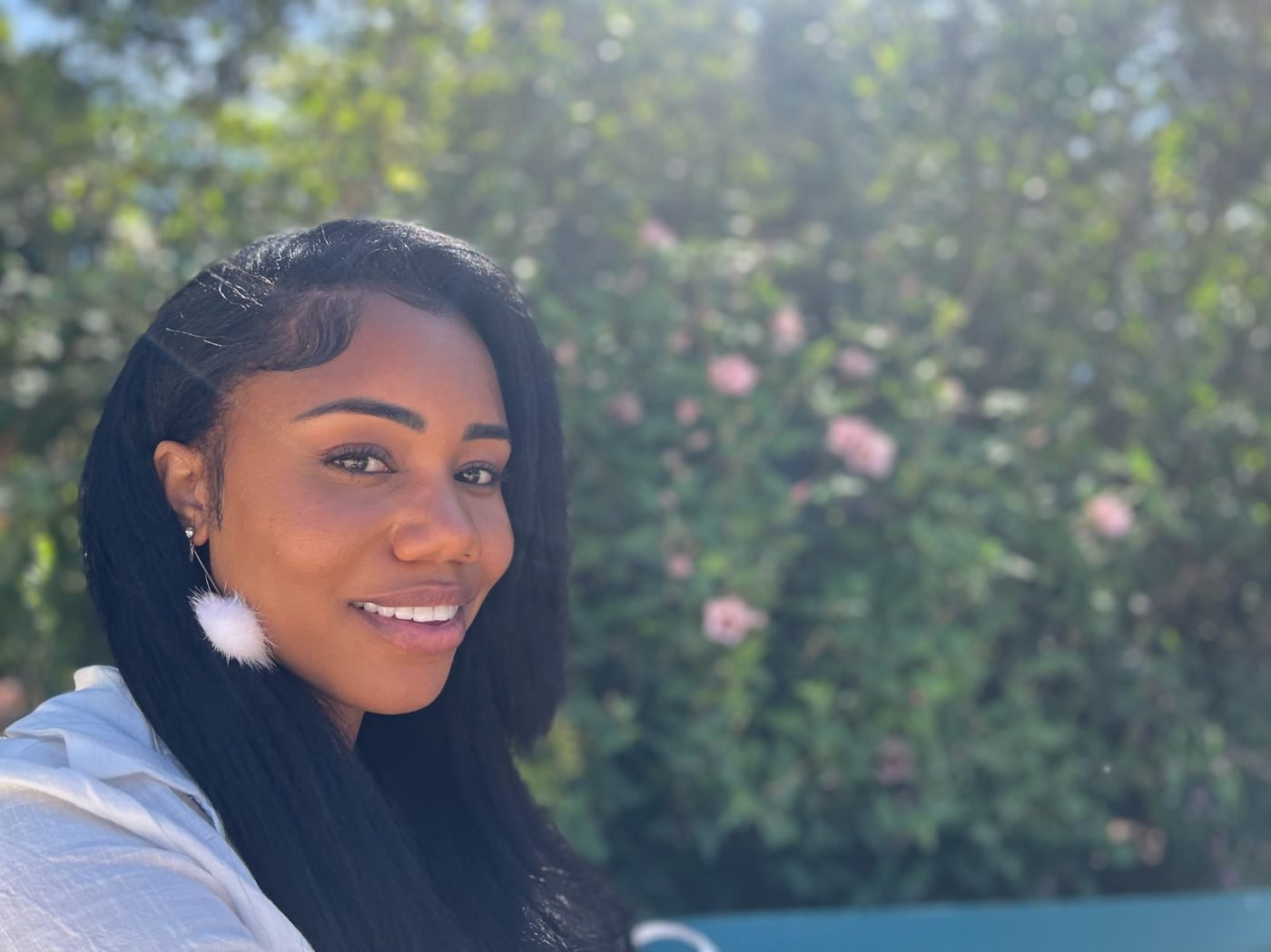 Brandi Harris smiling in a garden
